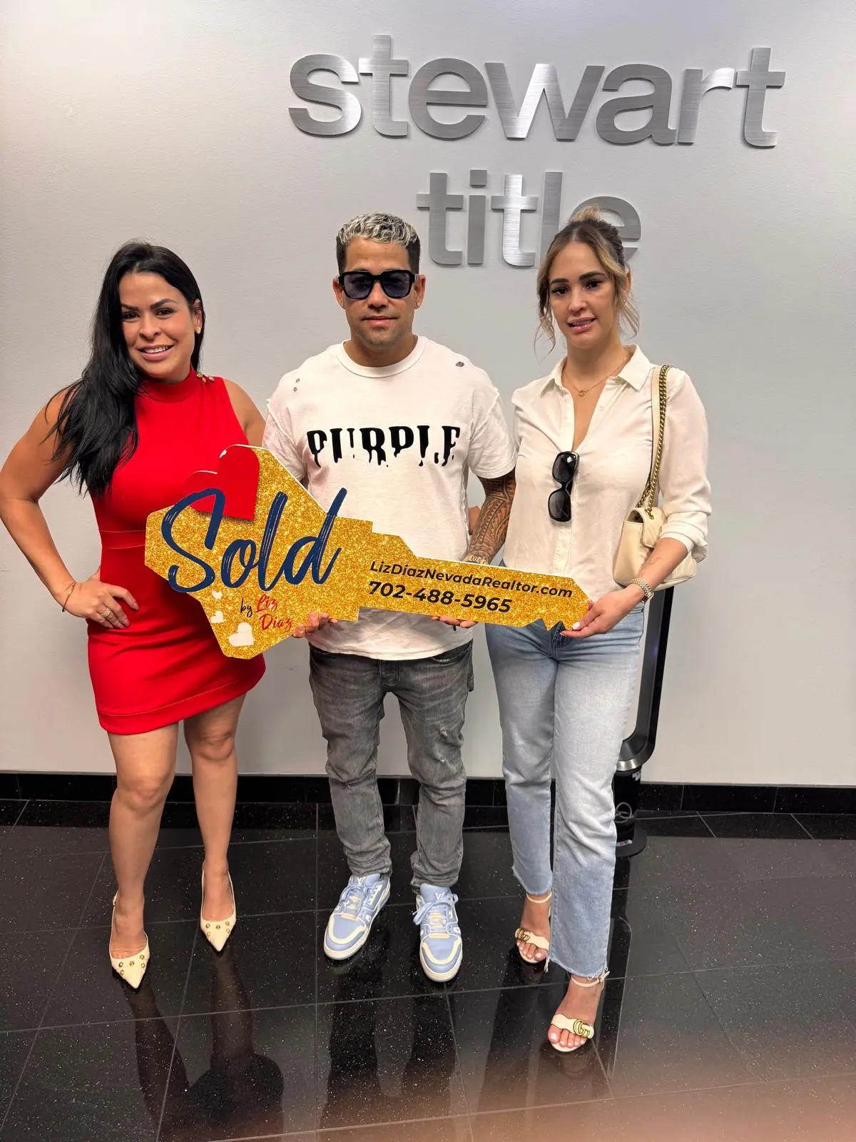 Handing over elegant gold keys to a new luxury property