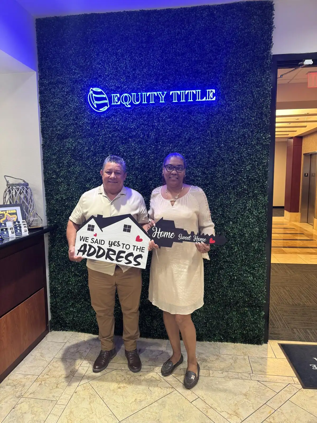 A joyful couple receiving keys to their modern luxury home
